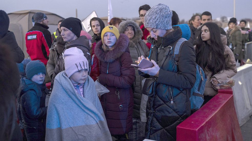 Geflüchtete Ukrainer im Grenzgebiet zwischen ihrem Heimatland und Polen. Foto: Petros Giannakouris/ DPA