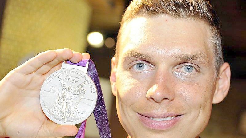 Tony Martin mit der olympischen Silbermedaille auf einer Aufnahme aus dem Jahre 2012. Foto: picture alliance / dpa