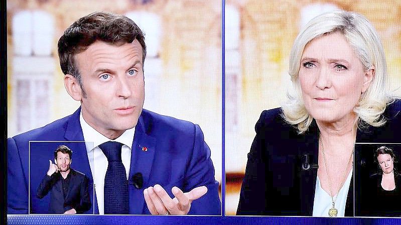 Bei der zweiten Runde der französischen Präsidentschaftswahl treten der proeuropäische Mitte-Politiker und Amtsinhaber Macron und die rechtsnationale Le Pen gegeneinander an. Foto: Ludovic Marin/AFP/dpa