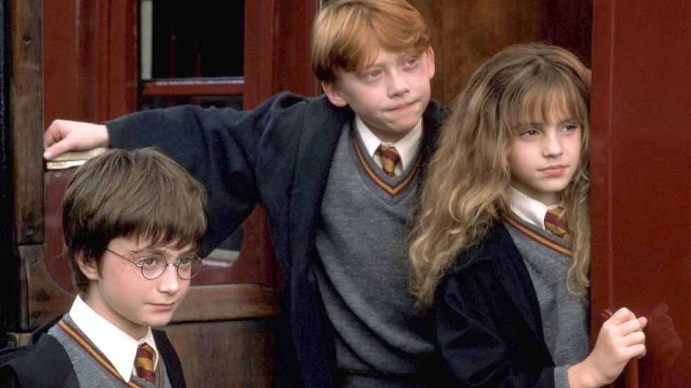 Emma Watson, Daniel Radcliffe (L) und Rupert Grint, Filmszene aus „Harry Potter und der Stein der Weisen“ Foto: Imago Images / Granata Images