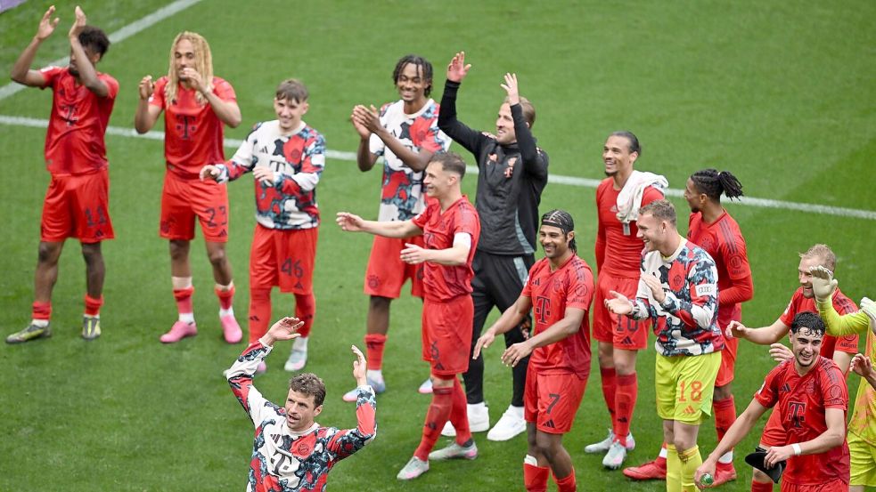Die Bayern feierten mit angezogener Handbremse in Leipzig. Foto: Hendrik Schmidt/dpa