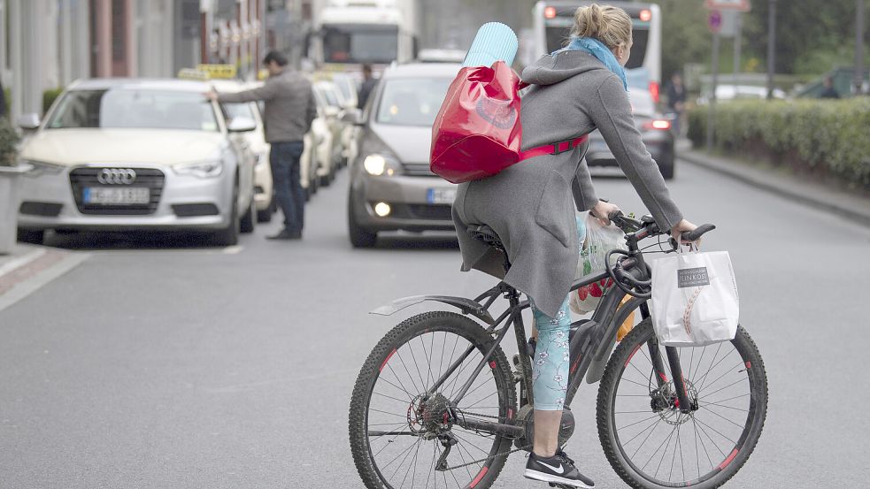 Radfahren wird durch den Klimataler mit kleinen Shopping-Goodies verbunden. Foto: DPA