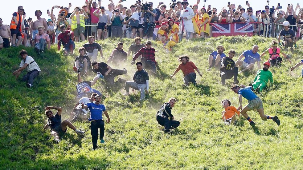 Das Käserennen in England hat Tradition. Foto: Jacob King