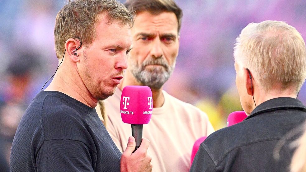 Jürgen Klopp (M) will nicht über ein Engagement als Bundestrainer spekulieren. Foto: Tom Weller/dpa