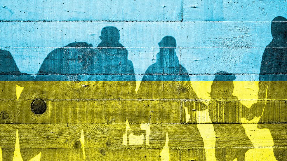 Graffiti an einer Hauswand: Ukrainer auf der Flucht. Tatsächlich stellen immer weniger Menschen aus der Ukraine einen Schutzantrag. Foto: IMAGO/Klaus Rein