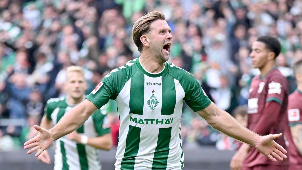 Niclas Füllkrug jubelt über sein Tor gegen Augsburg. Foto: David Inderlied/dpa