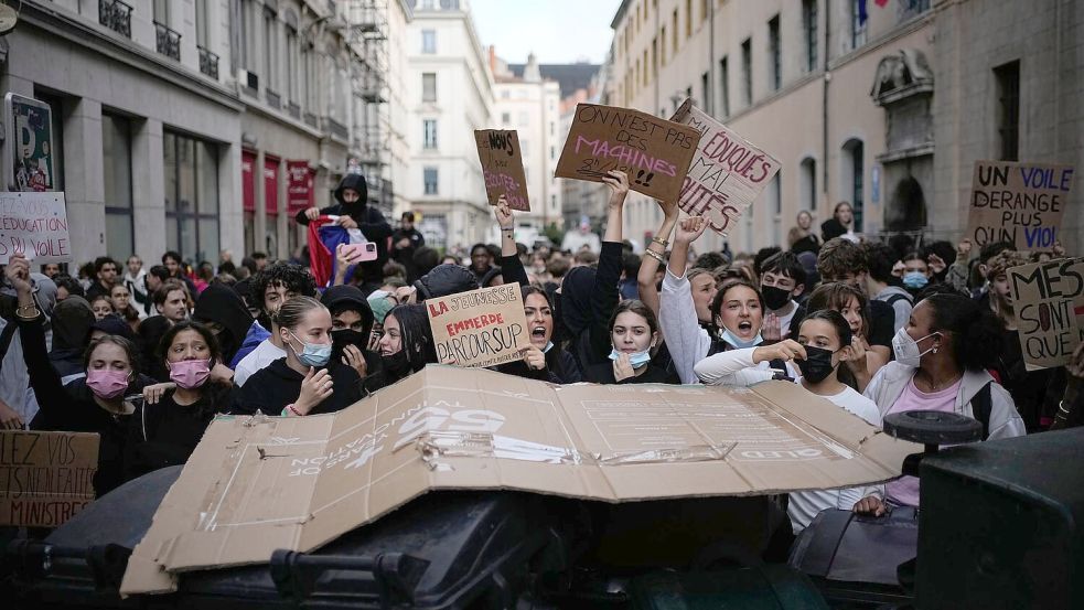 Bei den Protesten geht es auch um Chancengleichheit. Foto: Laurent Cipriani/AP/dpa